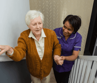 Mobile Header - Carer helping service user up the stairs.png